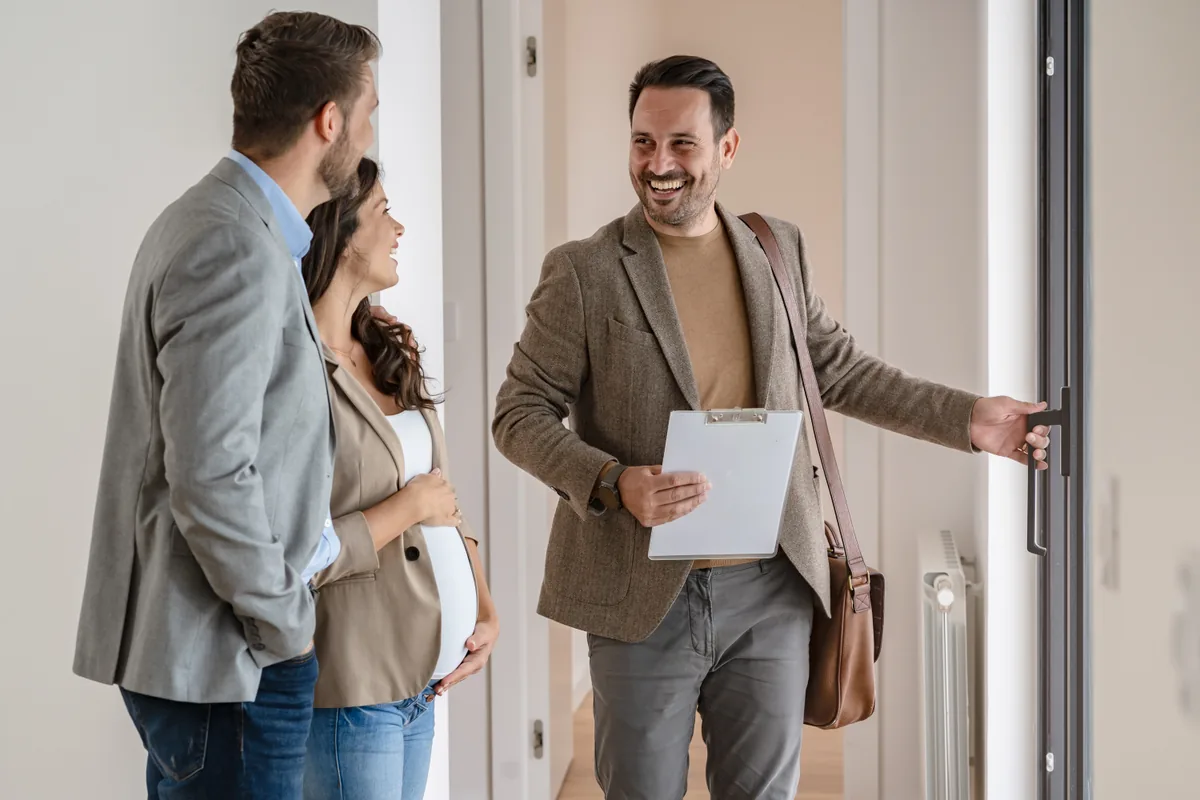 A Sextant France property consultant welcoming clients into a property