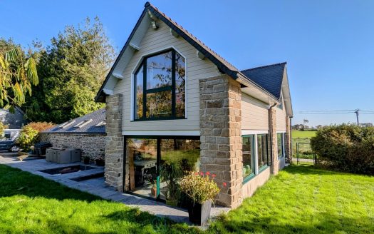 Stone house bordering the forest with land