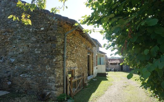 Old farmhouse nestled in the heart of lush, unspoiled nature.
