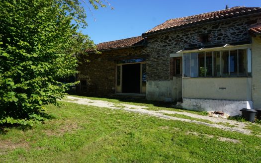 Old farmhouse nestled in the heart of lush, unspoiled nature.