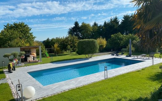 Beautiful features: 5-bedroom house, garage, swimming pool, landscaped garden