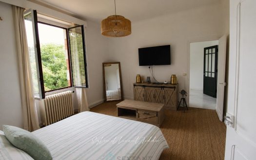 Renovated stone bourgeois house with swimming pool, outbuildings, and over 3.6 hectares of land.