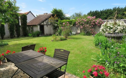 Old 19th century house, enclosed garden and landscape.