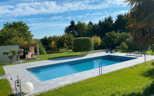 Beautiful features: 5-bedroom house, garage, swimming pool, landscaped garden