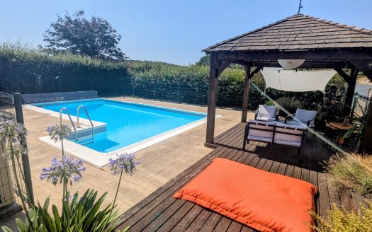Exclusive listing – Beautiful family property with heated swimming pool and open views