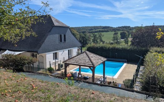 Exclusive listing – Beautiful family property with heated swimming pool and open views